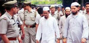 Tariq Qasmi and Khalid Mujahid, before his death, in police custudy